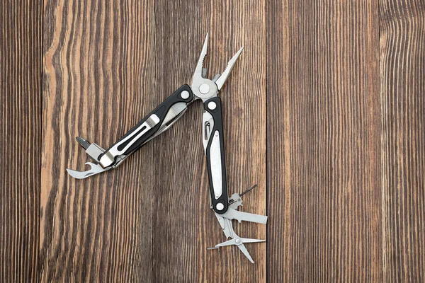 A fa felülettel Multitool — Stock Fotó