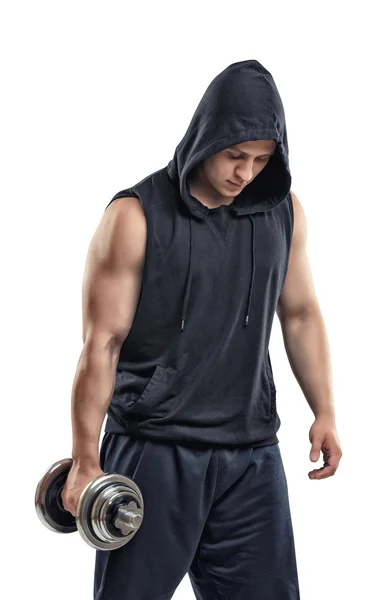 Recorte atlético joven en sudadera con capucha levantando una mancuerna bíceps abultados — Foto de Stock