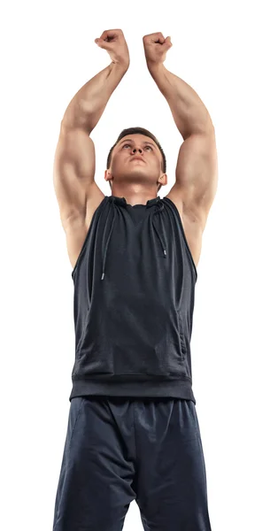 Taillenbild eines gut aussehenden muskulösen jungen Mannes, der für die Kamera posiert. — Stockfoto