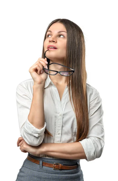 Jonge doordachte zakenvrouw op zoek naar boven met brillen in haar arm geïsoleerd op de achtergrond whire — Stockfoto