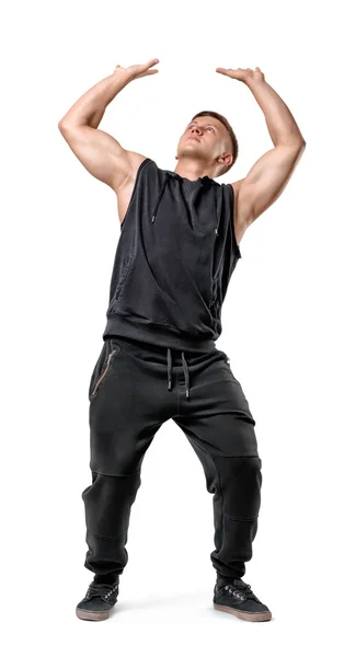 Ganzkörperporträt eines gut aussehenden muskulösen jungen Mannes, der unsichtbare Wand unter Druck isoliert auf weißem Hintergrund schiebt — Stockfoto