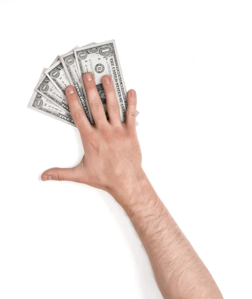 Mans hand lying on dollar bills — Stock Photo, Image