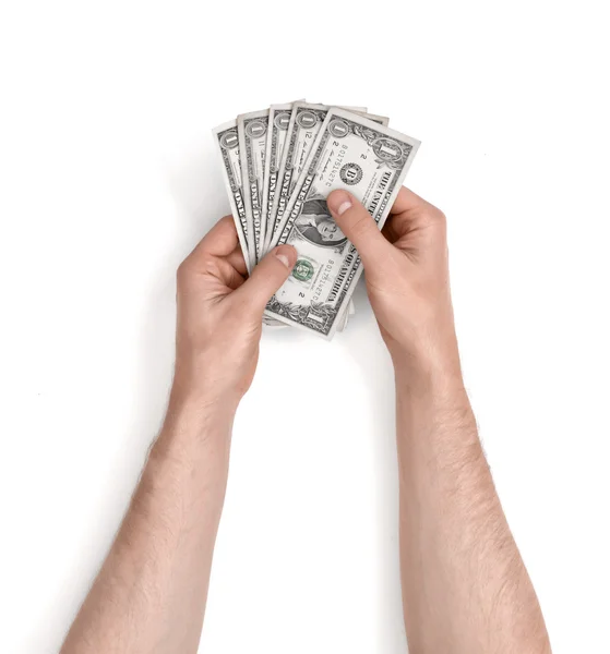 Mãos de homem segurando notas de um dólar no fundo branco . — Fotografia de Stock