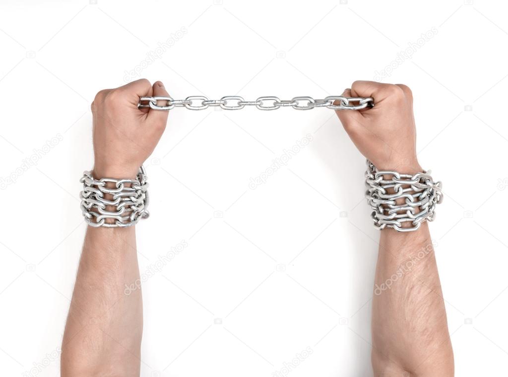 Close up view of chained mans hands