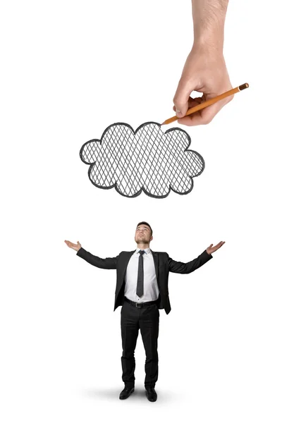 Empresário fica com as mãos levantadas e grande mão acima que desenha nuvem, isolado no fundo branco — Fotografia de Stock
