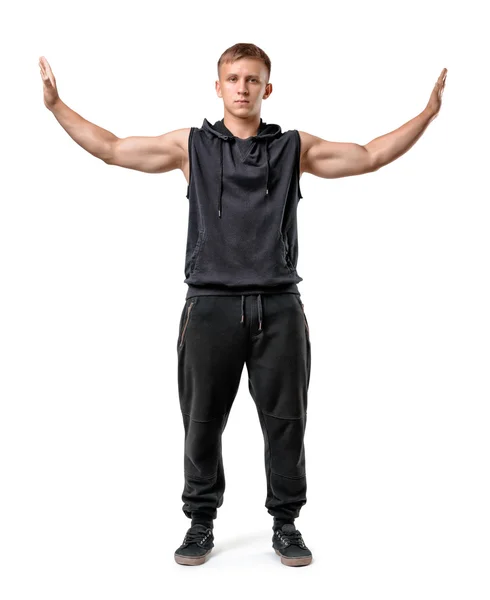 Muskulöser junger Mann steht vor unsichtbaren Wänden, die Hände isoliert auf weißem Hintergrund — Stockfoto
