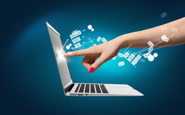 Hand touch laptop, icons around — Stock Photo, Image