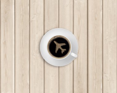 Black coffee with plane-shaped foam
