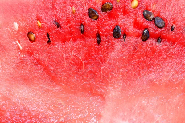 Rode achtergrond watermeloen — Stockfoto