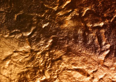 Altın buruşuk dokunun fotoğraf arkaplanı aydınlatıldı