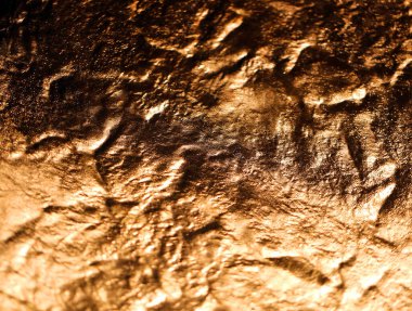 Altın buruşuk dokunun fotoğraf arkaplanı aydınlatıldı