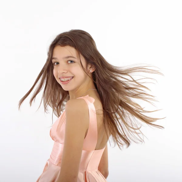 Beautiful young teen girl with brackets on teeth in white — Stock Photo, Image