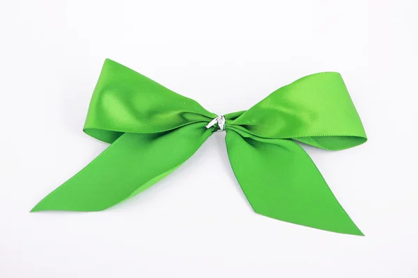 Green thin ribbon bow, isolated on white — Stock Photo, Image