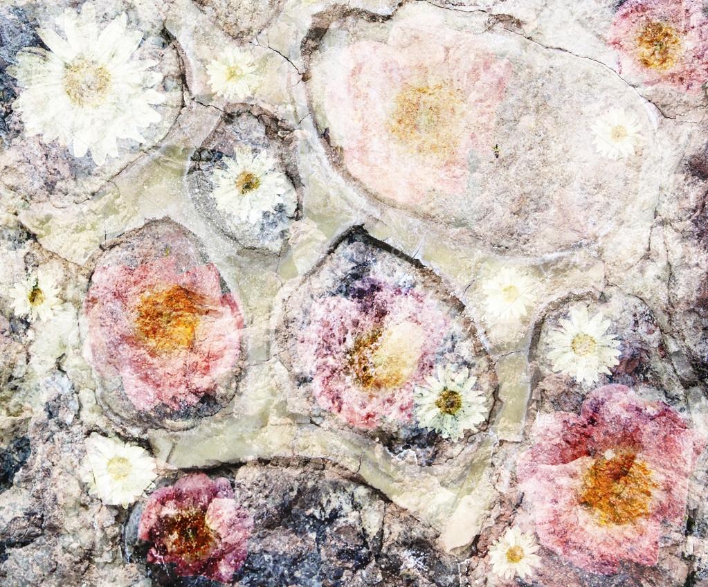 Scenic abstract background on the stones with pink and yellow fl