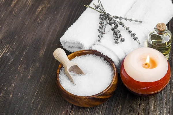 Spa still life with sea salt, towels and bath oil — Stock Photo, Image