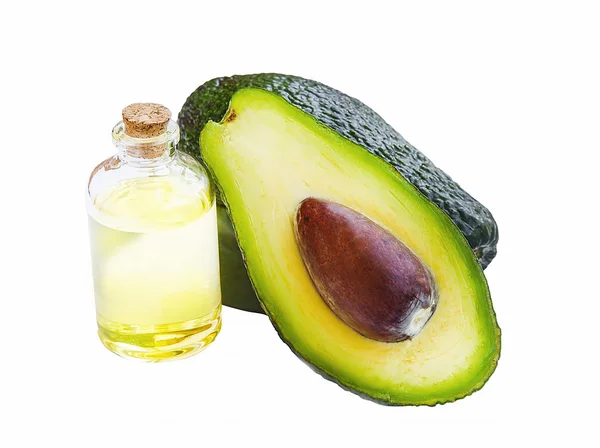 Avocado olie in fles met avocado fruit geïsoleerd — Stockfoto