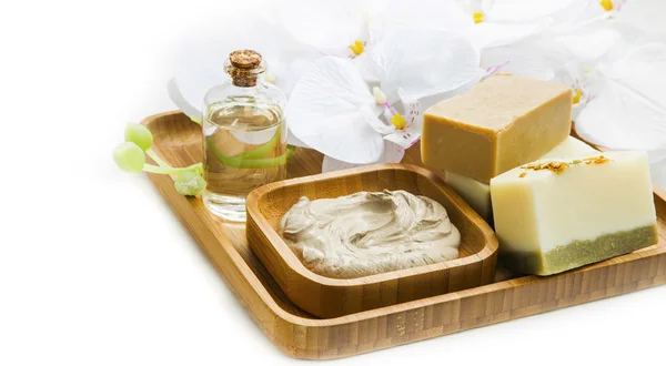 Spa still life with clay mask,natural soap and orchid — Stock Photo, Image
