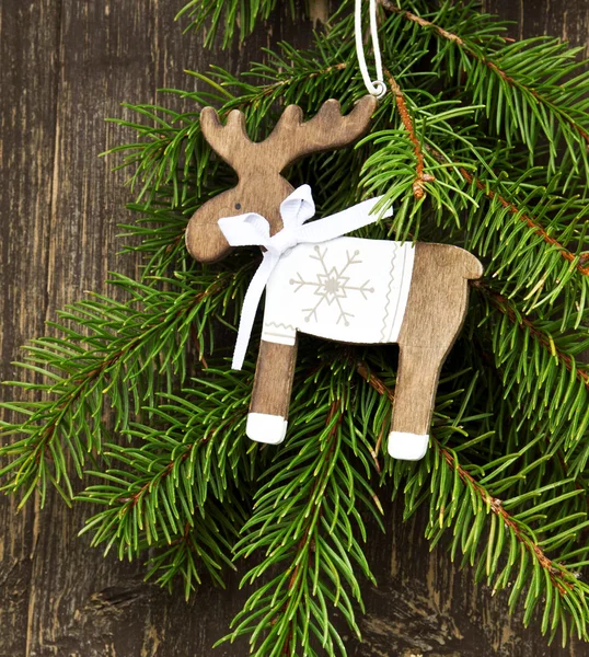 Vintage Wooden Reindeer Christmas Decoration and Fir Tree Branch — Stock Photo, Image