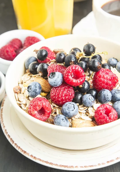 Muesli with Raspberry,Blueberry and Currant, Coffee and Juice — Stockfoto