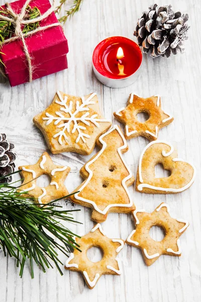 Christmas Gingerbread Cookies with Ornaments on Wooden Board — Stock Photo, Image