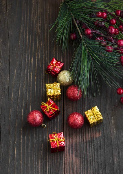 Golden and Red Christmas Gifts and Balls with Fir Tree Branch De — Stock Photo, Image