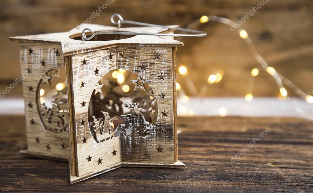 Rustic wooden Christmas candle holder with festive lights — Stock Photo
