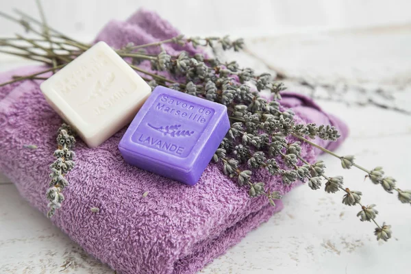 Spa products with lavender soap,flowers and towel — Stock Photo, Image