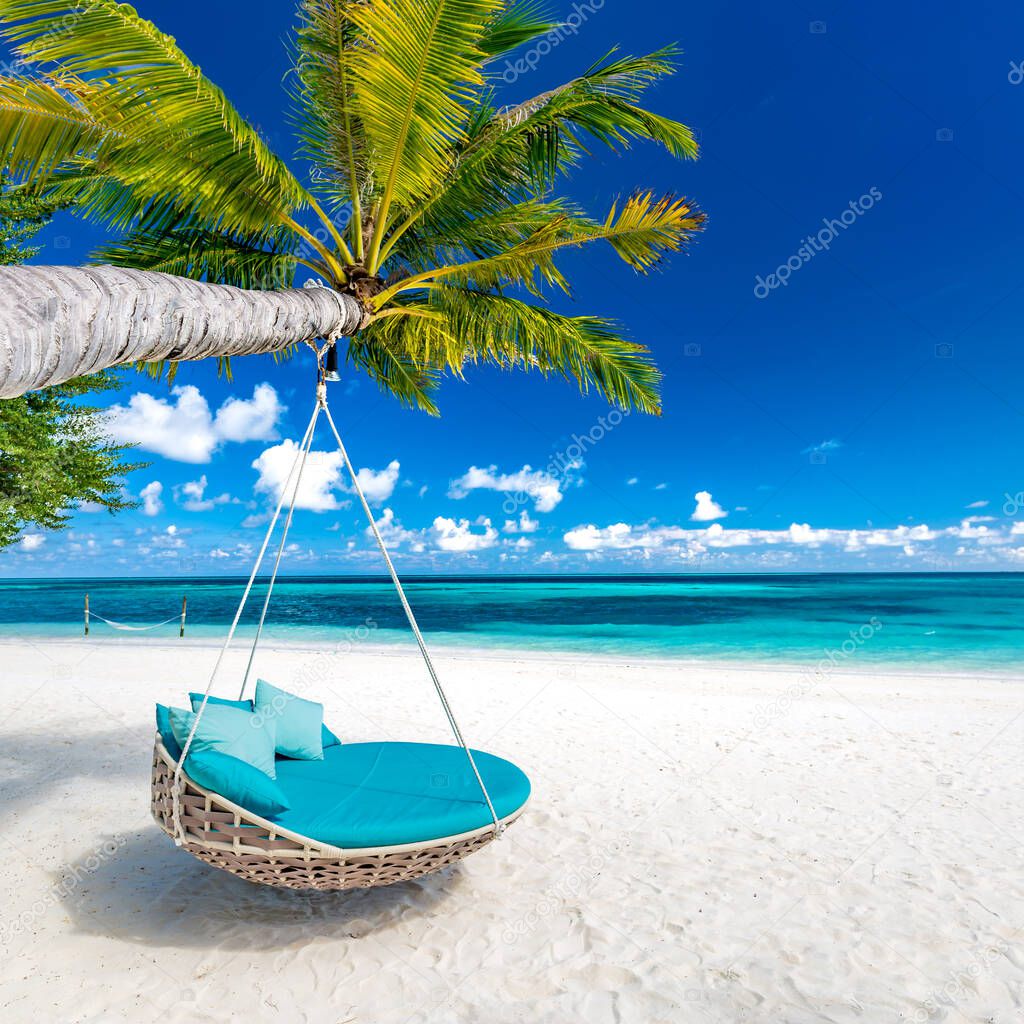 Tropical beach background as summer landscape with beach swing or hammock and white sand and calm sea for beach banner. Perfect beach scene vacation and summer holiday concept. Luxury carefree travel destination, romantic view