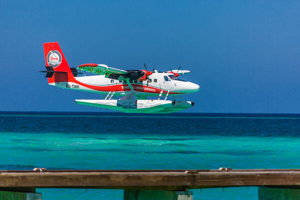 Ari Atoll, Maldives - 05.05.2018: Seaplane at tropical beach resort. Luxury summer travel destination with seaplane in Maldives islands. Exotic vacation or holiday transportation, Maldives sea