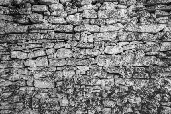 Stone wall texture, dramatic aged wall in black and white