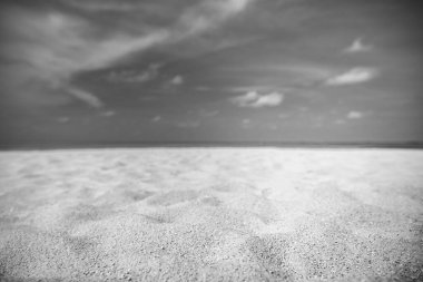 Abstract sea sand sky concept. Closeup of sand on beach and bright summer sky, calmness and inspiration nature concept. Summer beach background. Sand and sea and sky. Monochrome beach view, black and white process