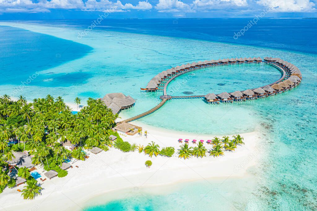 beautiful tropical maldives island with bungalows and turquoise water