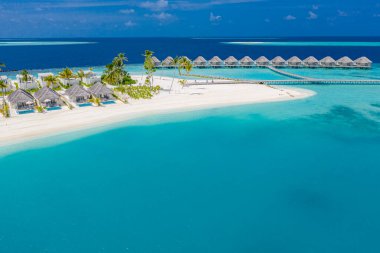 Aerial photo of beautiful Maldives paradise tropical beach. Amazing view, blue turquoise lagoon water, palm trees and white sandy beach. Luxury travel vacation destination. Sunny aerial landscape clipart