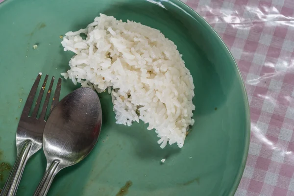 Sobras de arroz en el plato —  Fotos de Stock