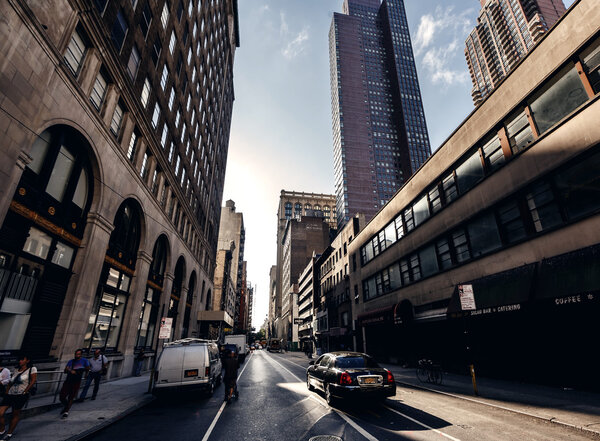NEW YORK, UNITED STATES - SEPTEMBER 10: Typical below view from street on famous skyscrapers in New York, USA