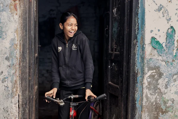 Indian girl rides on bicycle — Stock Photo, Image
