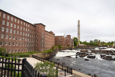 The historic brick pepperell center or former mill building in the town of Biddeford Maine clipart
