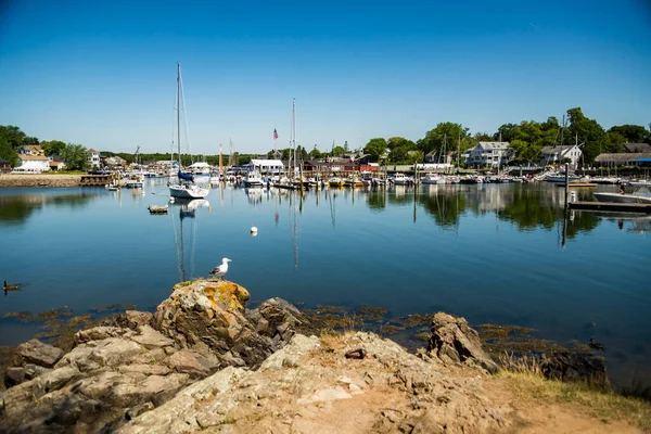 Sailboats anchored in a bay of Maine coast fishing port — Stock Photo, Image