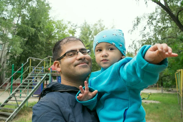 dad and son on a walk