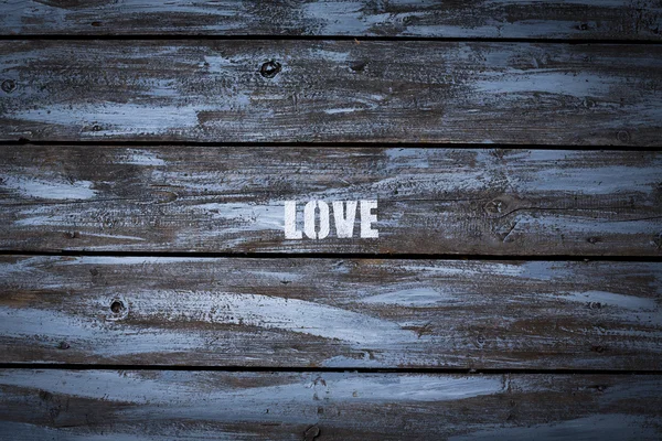 Láska na dřevěné pozadí — Stock fotografie