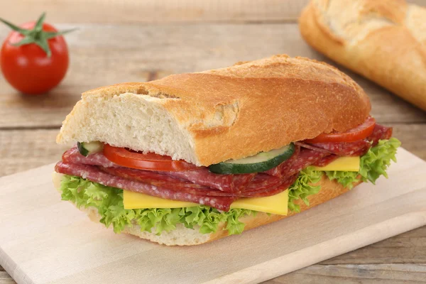 Sub sandwich baguette with salami ham for breakfast — Stock Photo, Image