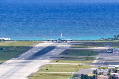 Sint Maarten, Netherlands Antilles - September 18, 2016 KLM Asia Boeing 747-400 airplane at Sint Maarten Airport (SXM) in the Caribbean. clipart