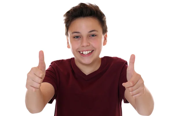 Усміхнений молодий хлопчик-підліток показує великі пальці вгору — стокове фото