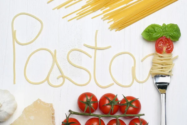 Ingredients pasta spaghetti noodles on a fork — Stock Photo, Image