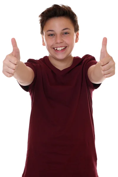 Успешный мальчик-подросток показывает большие пальцы вверх — стоковое фото