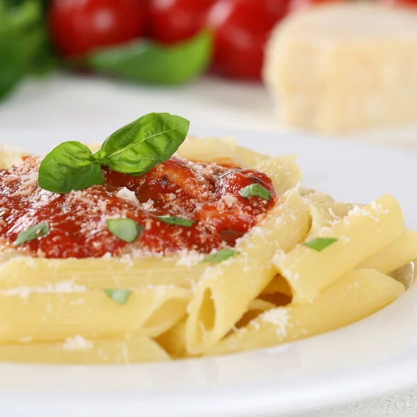 Pasta with Napoli tomato sauce noodles meal with basil on a plat — Stock Photo, Image