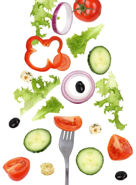 Eating falling green salad with fork, tomatoes and cucumber — Stock Photo, Image