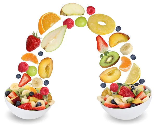 Flying fruit salad in bowl with fruits like apples, oranges, pea — Stock Image Flying fruit salad in bowl with fruits like apples, oranges, pea Stock Photo