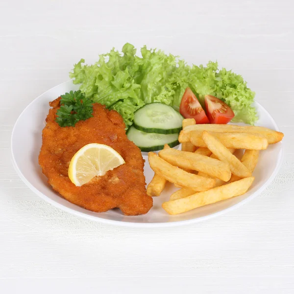 Schnitzel with french fries and salad on plate — Stock Photo, Image