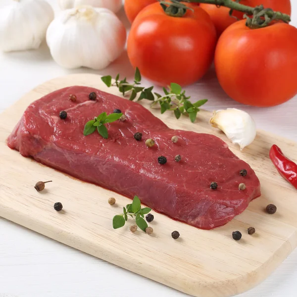 Raw beef meat steak on cutting board — Stock Photo, Image